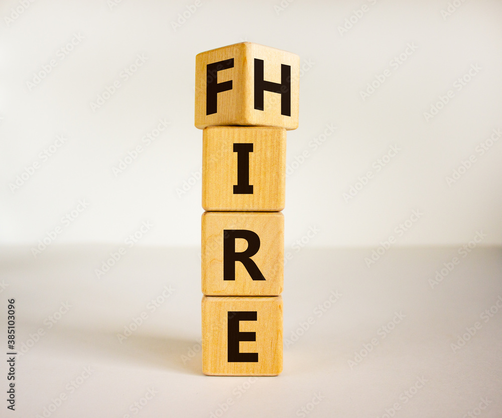 Turned a cube and changed the word 'fire' to 'hire'. Beautiful white background, copy space. Business concept. Turned a cube and changed the word 'fire' to 'hire'. Beautiful white background, copy space. Business concept.