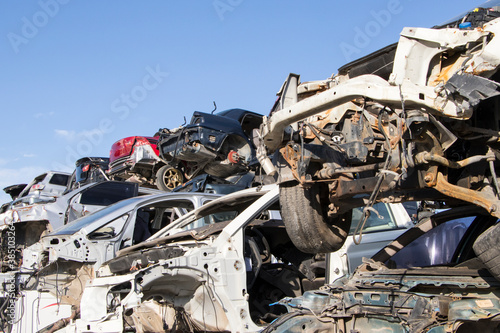 cars waiting to be recycle in junk yard in Turkey, Ankara - stacked cars in car cemetery - auto graveyard © gokturk_06