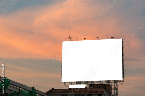 blank billboard for new advertisement with sunset sky background