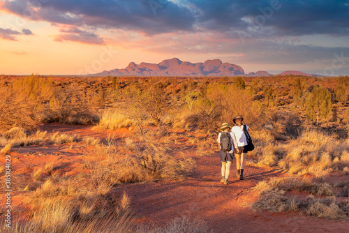 Northern Territory, Australia - Hikers in the Australian outback admiring the spectacular landscape. photo