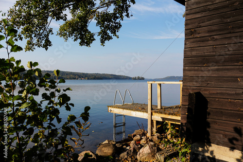 Obraz na plátně Descent for swimming near the Finnish sauna on the picturesque lakeside