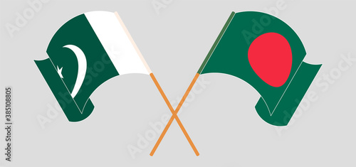 Crossed and waving flags of Bangladesh and Pakistan