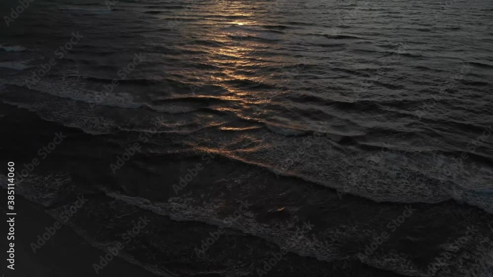 Aerial reveal shot of Sunset over the sea - 4k drone pan reveal shot Aerial reveal shot of Sunset over the sea - 4k drone pan reveal shot