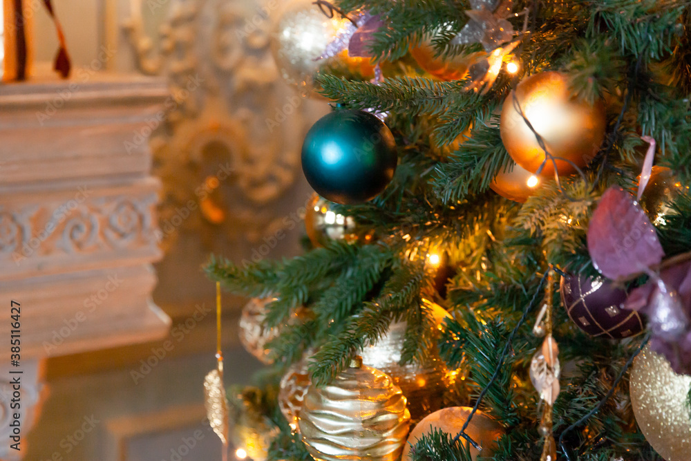 Classic Christmas New Year decorated New year tree with golden ornament decorations toy and ball. Modern white classical style interior design apartment. Christmas eve at home. Classic Christmas New Year decorated New year tree with golden ornament decorations toy and ball. Modern white classical style interior design apartment. Christmas eve at home.