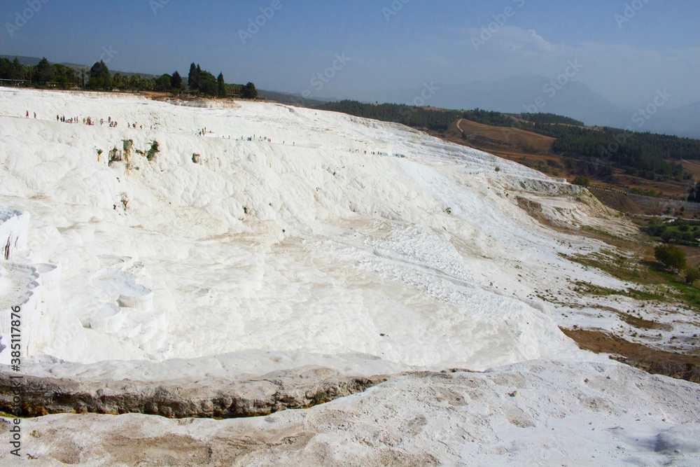 Panoramic view onto famous natural travertine pools and terraces of Pamukkale, Turkey. All natural objects included in UNESCO