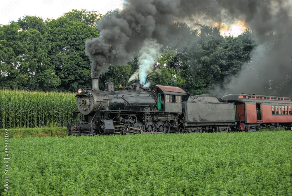 Restored Antique Steam Locomotive with Passenger Cars