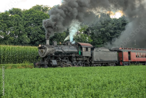 Restored Antique Steam Locomotive with Passenger Cars