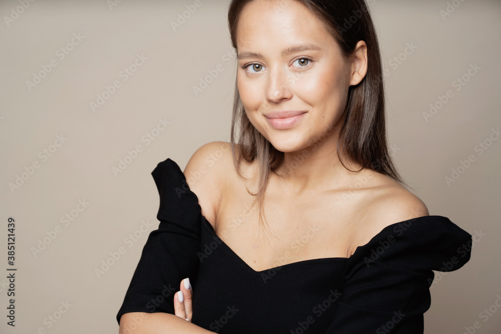 a satisfied young woman of Caucasian appearance, a brunette stands looking, smiling and posing for the camera. keeps your hands on your waist, black stylish jacket and good mood. a satisfied young woman of Caucasian appearance, a brunette stands looking, smiling and posing for the camera. keeps your hands on your waist, black stylish jacket and good mood.