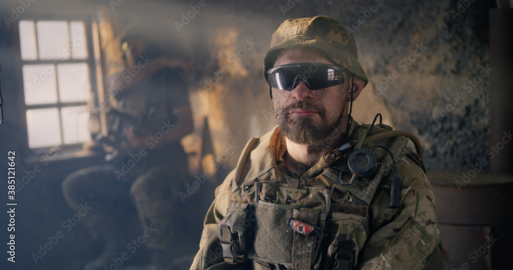 Confident American soldier in desolate building Confident American soldier in desolate building