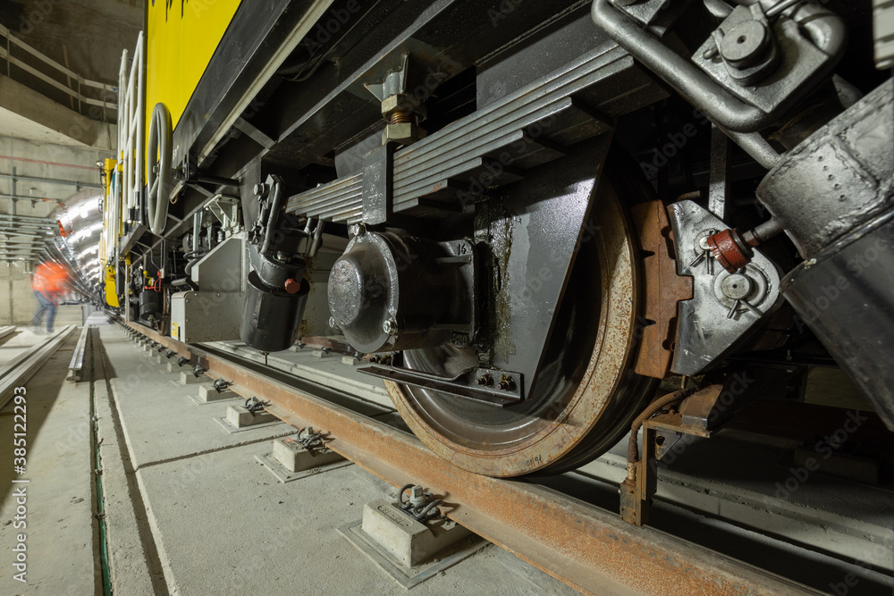 Closeup of the railway maintenance vehicle. Train wheels on rails. Closeup of the railway maintenance vehicle. Train wheels on rails.