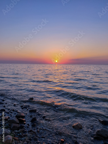 the sea shore at sunset