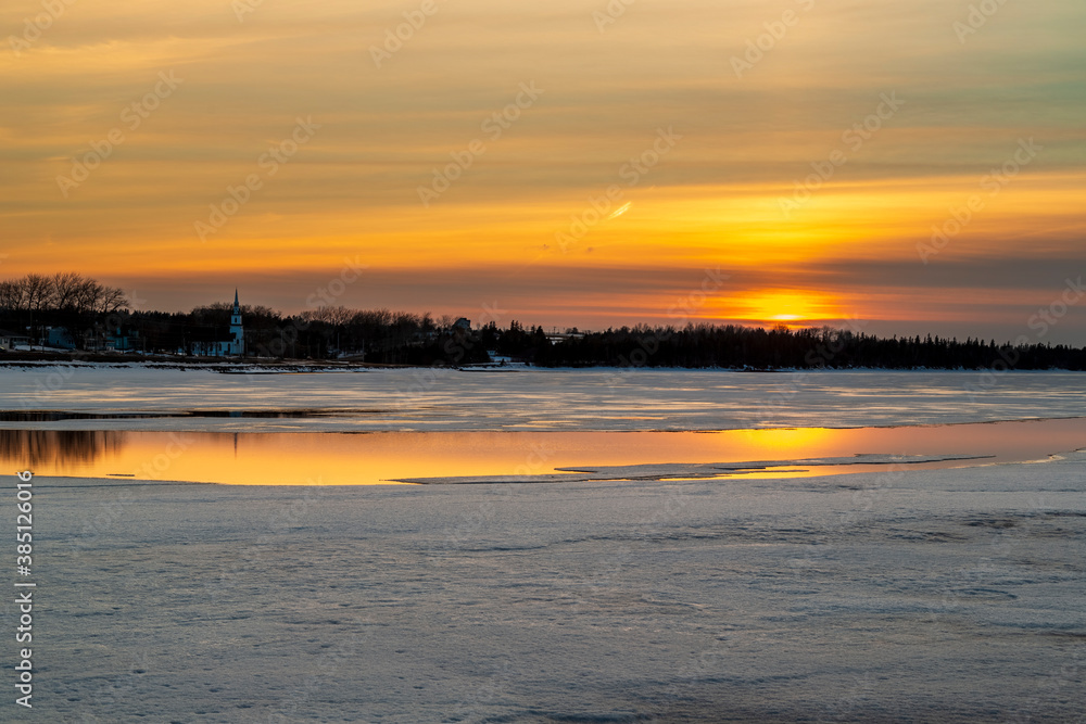 Chilly winter sunset over a frozen pond in Charlottetown, Prince Edward Island, Canada