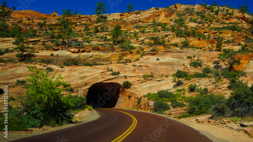 Road / Highway curve leading into a tunnle  photo