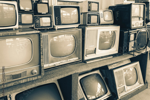 Rows of old TVs.The first televisions are tube-type.