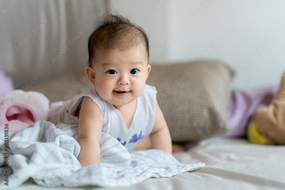 Baby smiling and adorable asian girl portrait c;ose up 