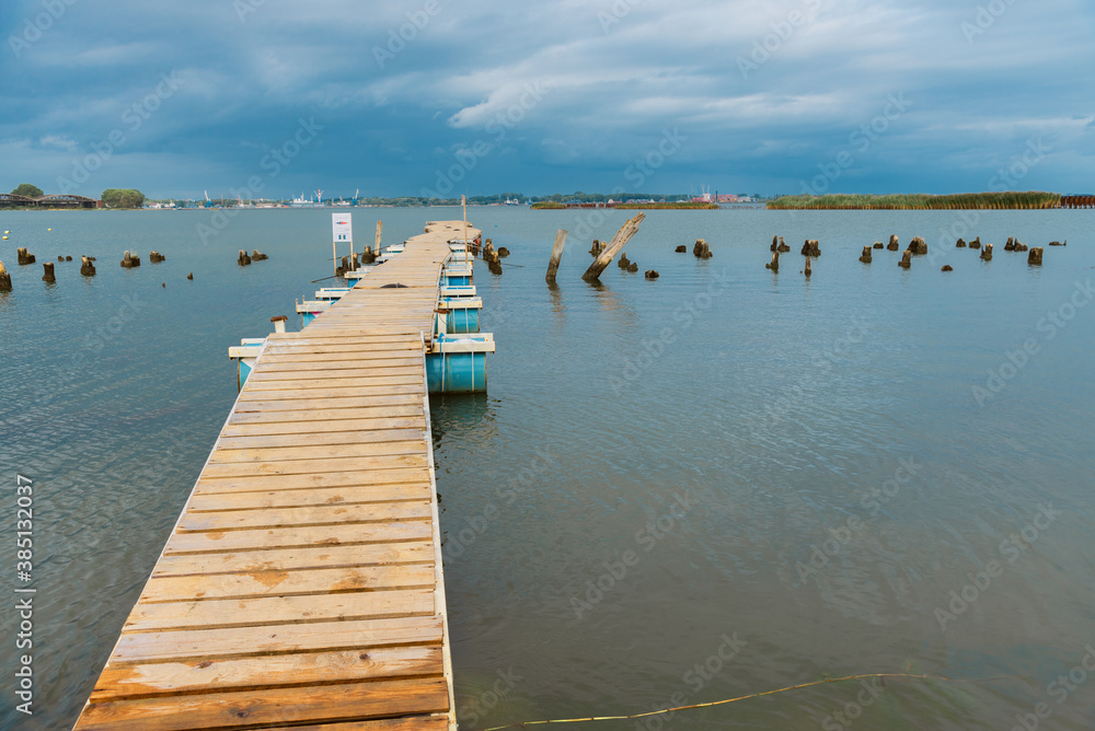 wooden pier on metal pontoons.
