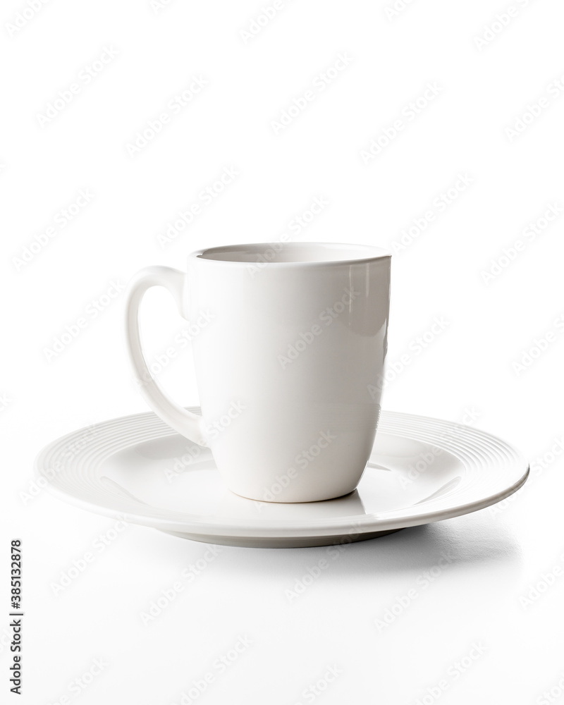 Porcelain cups and plates on white background, photo taken in studio Porcelain cups and plates on white background, photo taken in studio