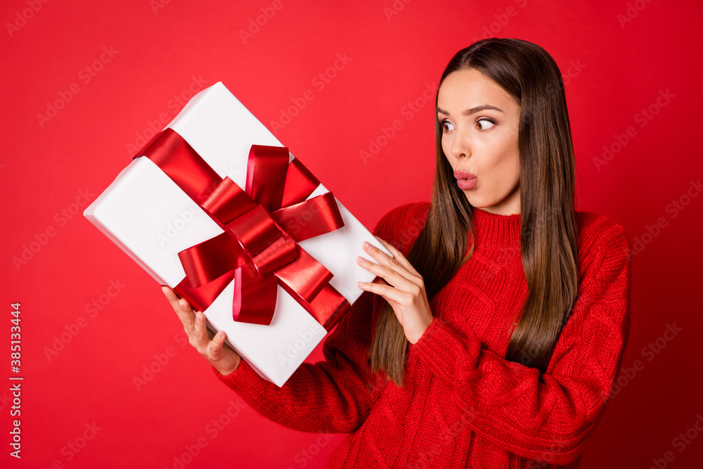 Photo of astonished girl get christmas newyear gift box wear pullover isolated over bright shine color background Photo of astonished girl get christmas newyear gift box wear pullover isolated over bright shine color background