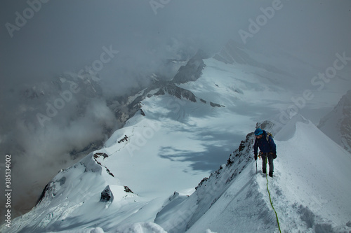 Mountaineer on a ridge in the swiss alps © Graham