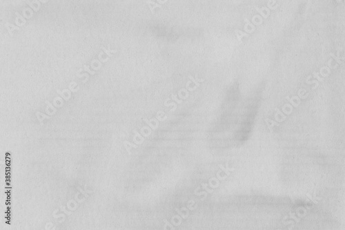 White vintage rough sheet of carton. Recycled environmentally friendly cardboard paper texture. Simple gray minimalist papercraft background.