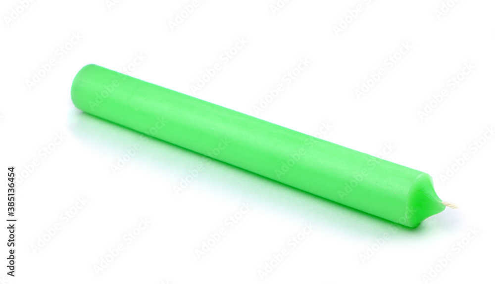 Candle isolated on a white background. Green candle. Candle isolated on a white background. Green candle.