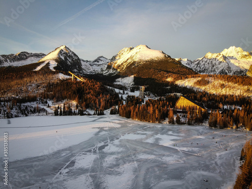 Aerial landscape by sunset of High Tatras mountains near Strbske Pleso, Slovakia photo