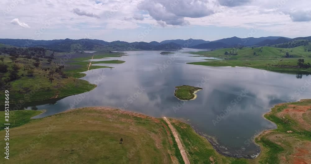 Surface of Lake Windamere between hill ranges in aerial panning as 4k.
Surface of Lake Windamere between hill ranges in aerial panning as 4k.