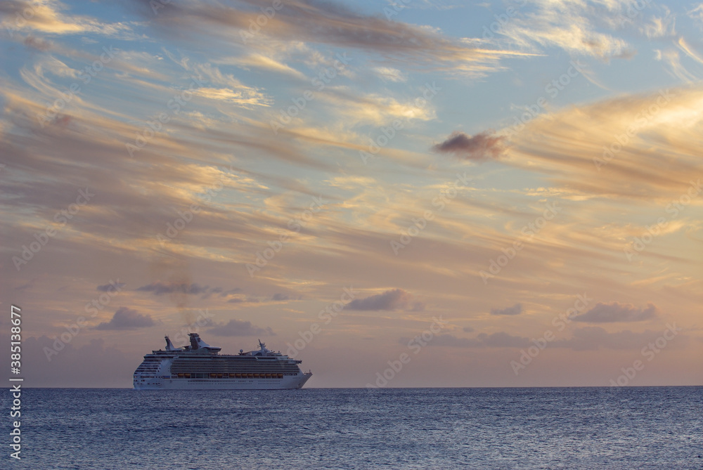 Cruise ship departing from St Maarten at sunset Cruise ship departing from St Maarten at sunset