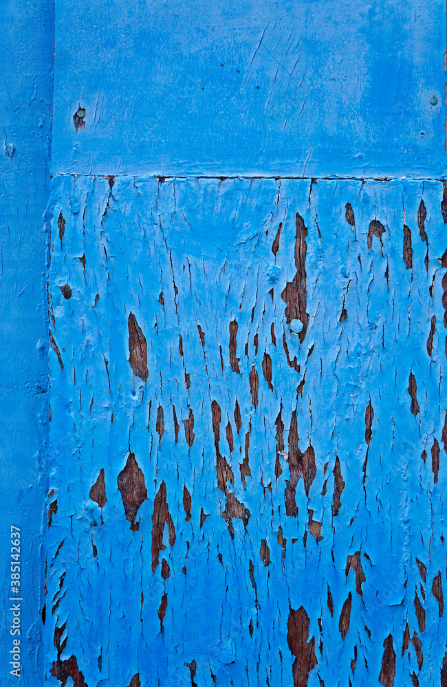 Old wooden door with peeling paint, Diamantina, Brazil Old wooden door with peeling paint, Diamantina, Brazil