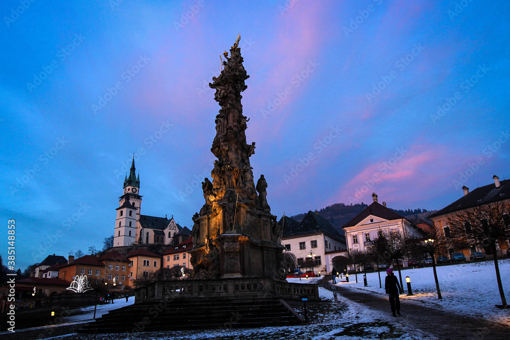 Central square with Plague Column by winter, Kremnica, Slovakia