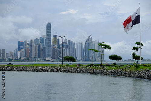 Panama City - Panama City Skyline view with Panama national flag - Monument Flag Of Panama