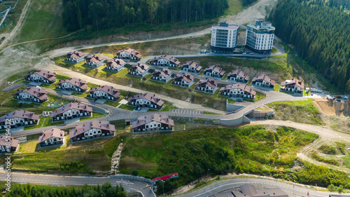 Top down aerial view of urban houses and streets in a residential area of Bukovel, Ukraine