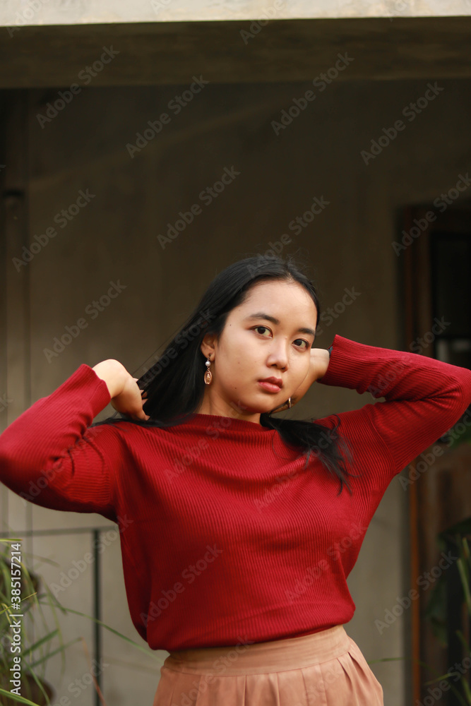Young beautiful woman wearing red casual t-shirt. Young beautiful woman wearing red casual t-shirt.