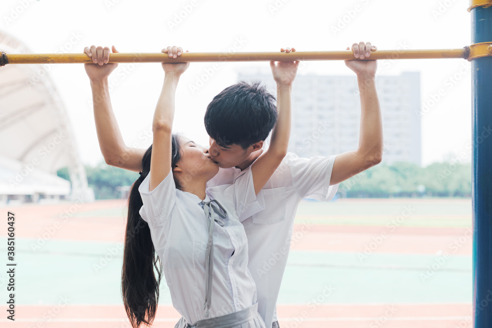 Young Asian college couple kissing Young Asian college couple kissing