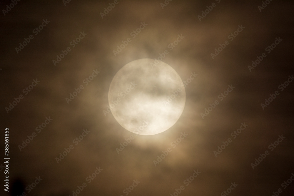 full moon in the night sky with clouds full moon in the night sky with clouds