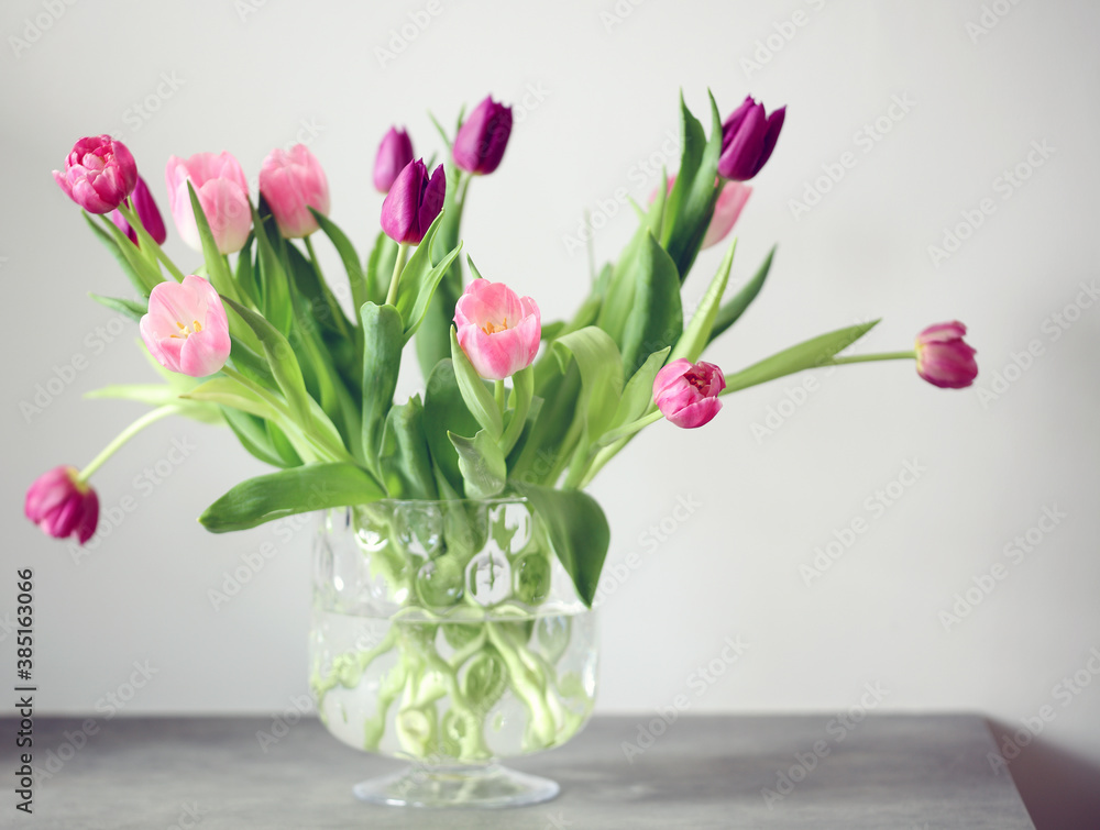 Bouquet of tulips in vase on counter Bouquet of tulips in vase on counter