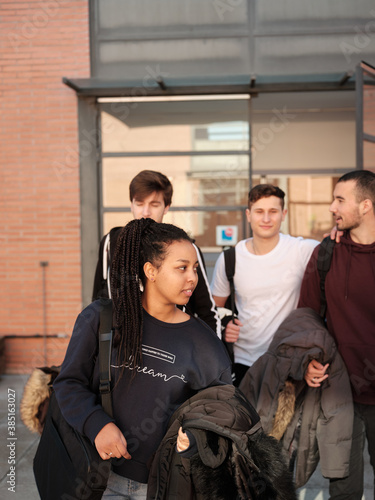 Group of young people walking together photo