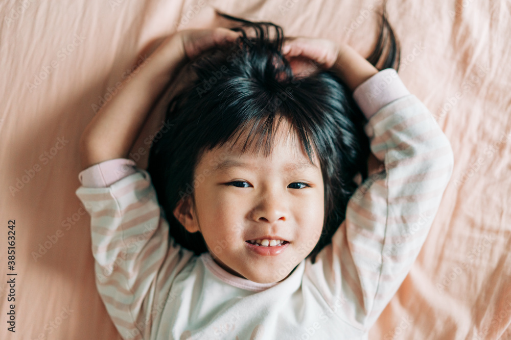 cute Asian little girl at home