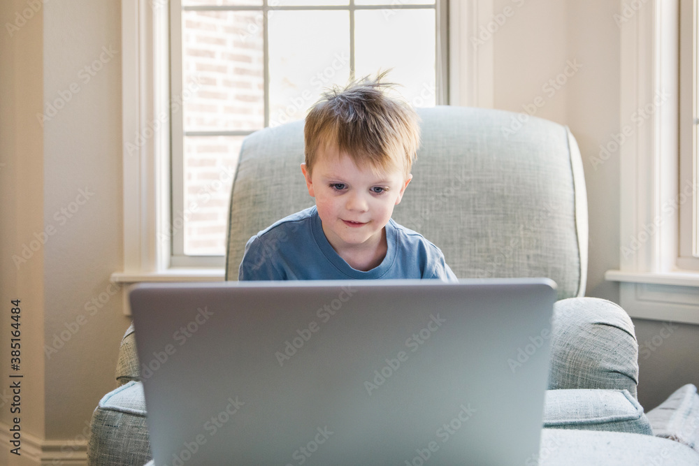 child attending a preschool music class from home child attending a preschool music class from home