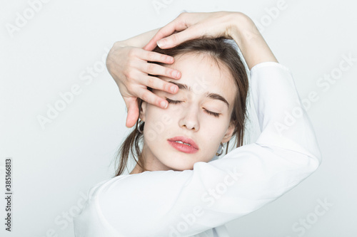 Portrait of a girl touching her face photo