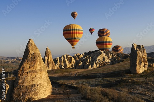 Fotografie Hot air balloon flight over the Goreme valley, Cappadocia, Turkey, Asia