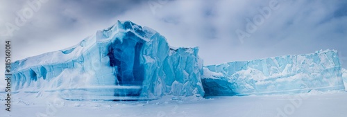 Panoramic view of icebergs seen from frozen fjord, Baffin Island, Davis Straight coast, Nunavut, Canada, North America photo