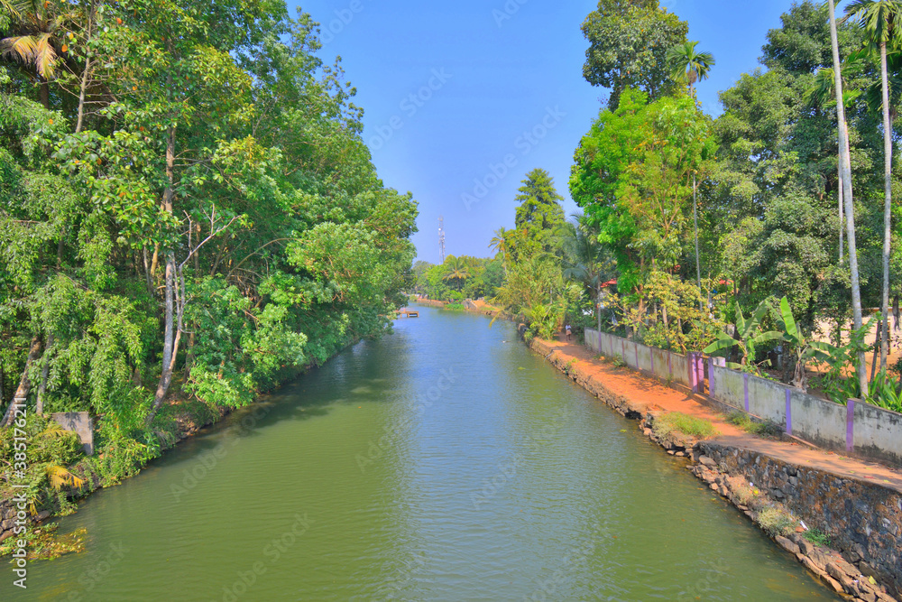 A canal passing through a town in Alappuzha, Kerala A canal passing through a town in Alappuzha, Kerala