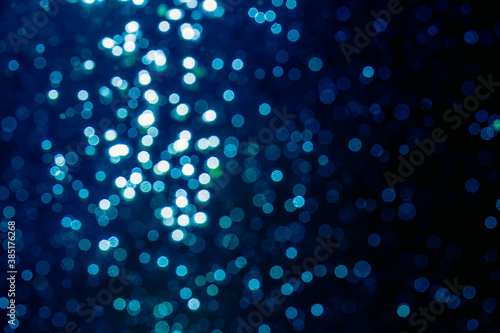 Abstract blue bokeh with black background