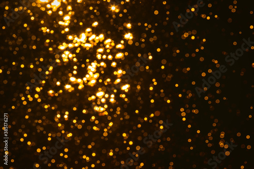 Abstract gold bokeh wirh black background