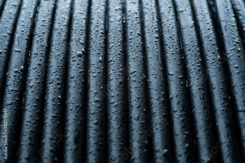 water drop on the black electric cable background