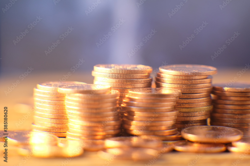 Stack of golden coins on black background and Advertising coins of finance and banking,Increasing columns of gold coins on table Stack of golden coins on black background and Advertising coins of finance and banking,Increasing columns of gold coins on table