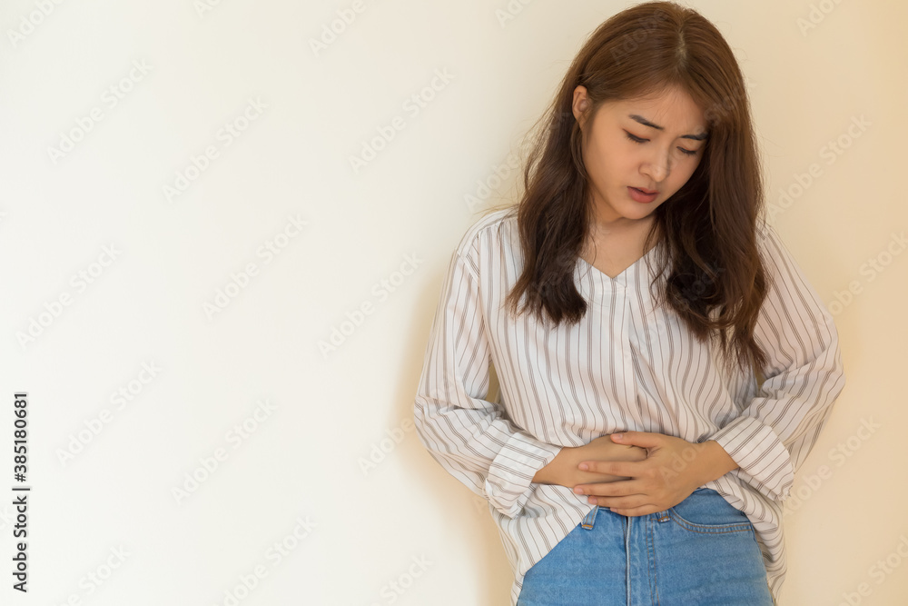 Fototapeta premium Young Asian women have severe stomachache