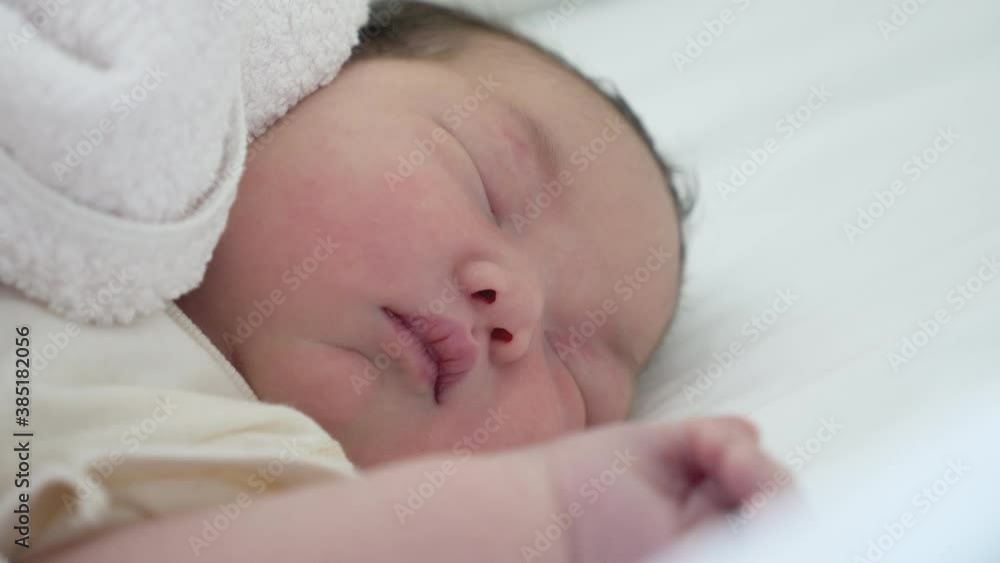 Close up shot of a newborn asian baby sleeping. Close up shot of a newborn asian baby sleeping.