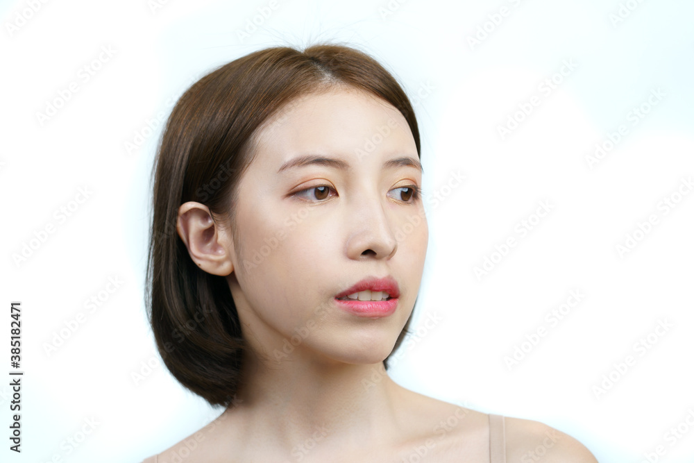 Asian woman face with healthy skin. Isolated on white background.